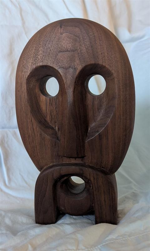 Stylized grandfather character mask photographed in portrait orientation